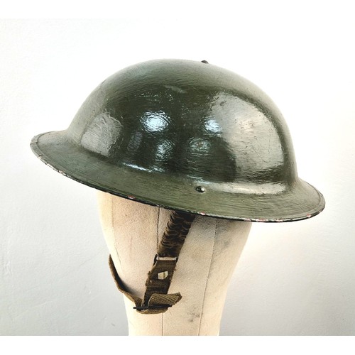 1026 - An Original Very Good Condition US 1940’s-1960’s Army Helmet, Repainted having been used by a re-ena... 