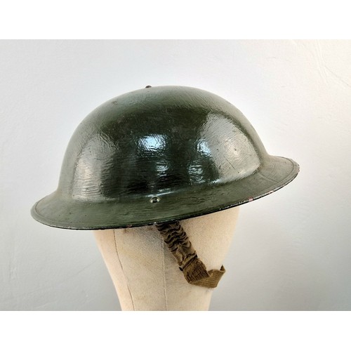 1026 - An Original Very Good Condition US 1940’s-1960’s Army Helmet, Repainted having been used by a re-ena... 