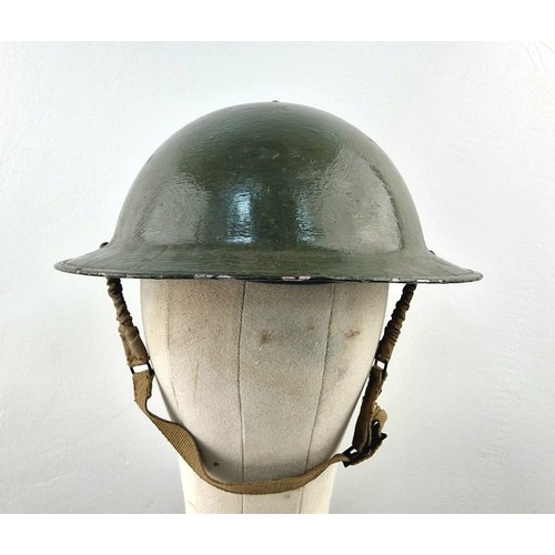 1026 - An Original Very Good Condition US 1940’s-1960’s Army Helmet, Repainted having been used by a re-ena... 