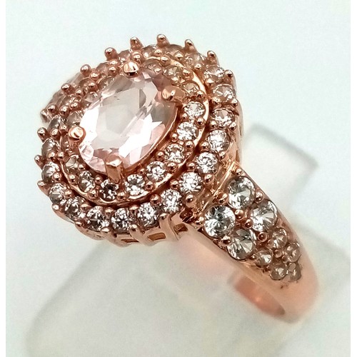 1209 - New Sterling Silver Rose Gold Gilt Cubic Zirconia Cluster Ring Size T. Set with a 6mm Oval Cut Centr... 