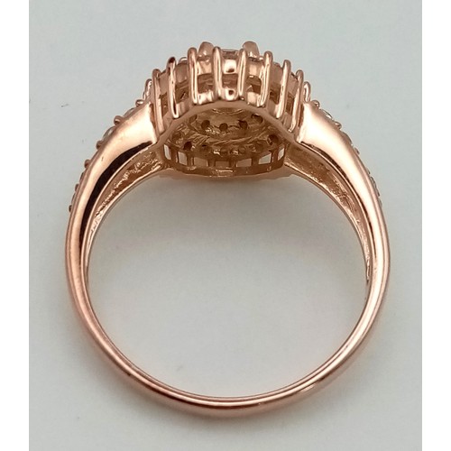 1209 - New Sterling Silver Rose Gold Gilt Cubic Zirconia Cluster Ring Size T. Set with a 6mm Oval Cut Centr... 