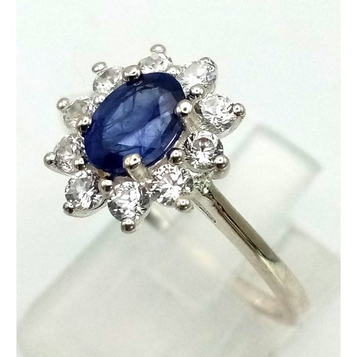 1291 - New Sterling Silver Blue and Clear Cubic Zirconia Cluster Ring Size T.

14mm Crown, Weight 2.46 Gram... 