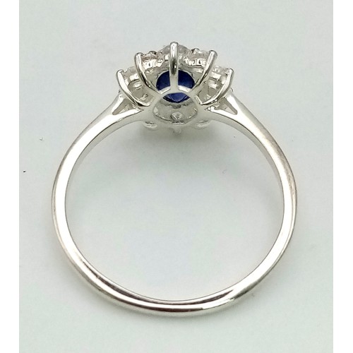 1291 - New Sterling Silver Blue and Clear Cubic Zirconia Cluster Ring Size T.

14mm Crown, Weight 2.46 Gram... 