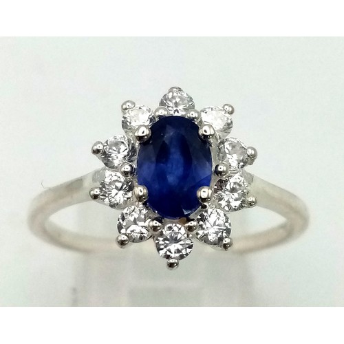 1291 - New Sterling Silver Blue and Clear Cubic Zirconia Cluster Ring Size T.

14mm Crown, Weight 2.46 Gram... 