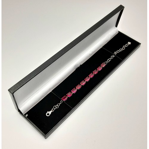 1325 - A New Sterling Silver and Synthetic Ruby Tennis Bracelet 20cm Length,

Weight 10 grams. In Presentat... 