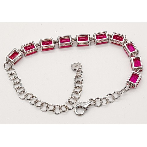 1325 - A New Sterling Silver and Synthetic Ruby Tennis Bracelet 20cm Length,

Weight 10 grams. In Presentat... 