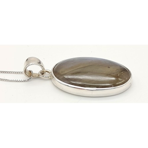 1333 - A New Sterling Silver Oval Cut Labradorite Cabochon Necklace. Stone Size 2.5cm. Chain Length 85cm. W... 