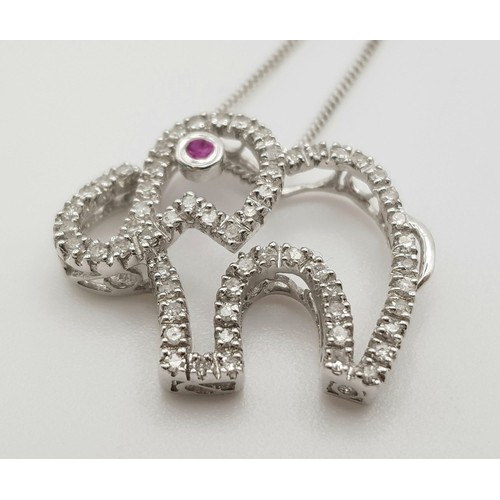 417 - 9K WHITE GOLD DIAMOND & RUBY SET, ELEPHANT PENDANT, ON A 42CM LENGTH CHAIN. TOTAL WEIGHT. 2.5G