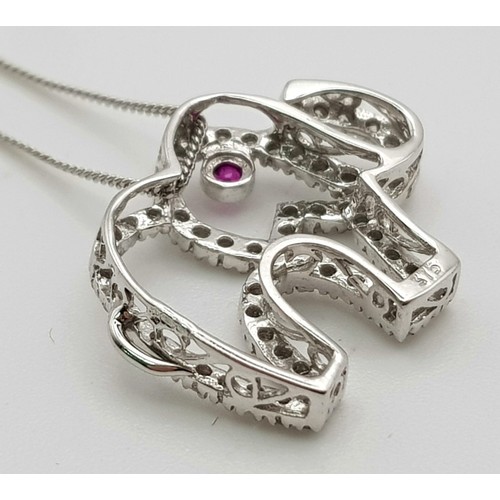 417 - 9K WHITE GOLD DIAMOND & RUBY SET, ELEPHANT PENDANT, ON A 42CM LENGTH CHAIN. TOTAL WEIGHT. 2.5G