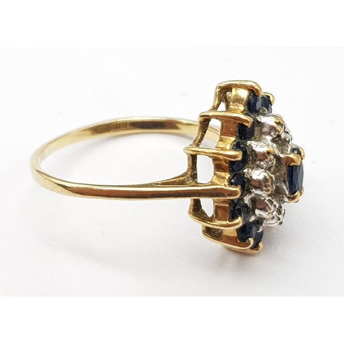 699 - 9K YELLOW GOLD DIAMOND & SAPPHIRE CLUSTER RING. WEIGHS 2G.  SIZE K/L