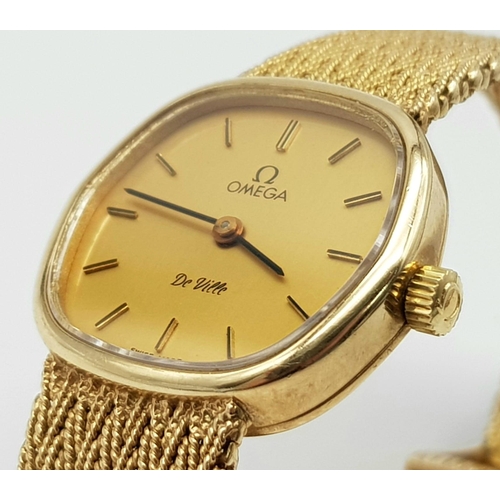 16 - A Solid 9k Gold Omega De Ville Ladies Watch. 9k gold bracelet and case - 22mm. Gold tone dial. Quart... 