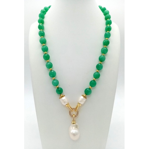 160 - A multi-faceted green jade necklace and earrings set, adorned with large, natural, white, baroque pe... 