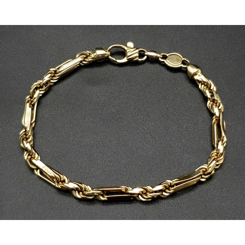 23 - A Gorgeous Italian 14K Yellow Gold Figaro Link Bracelet. 21cm. 22.39g