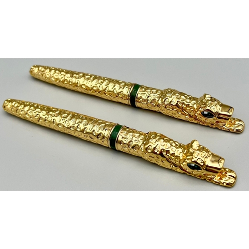 133 - A designer style, heavy, panther shaped, pair of gold filled pens in presentation boxes. One is a fo... 