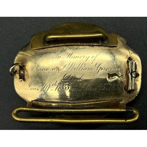 10 - A Victorian Mid-Karat Gold and Onyx Memorial Brooch. Inscription verso for 1847. Scrolled decoration... 