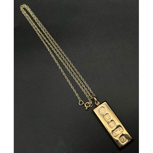 3 - A 9K Yellow Gold Ingot Pendant on a 9K Yellow Gold Chain. 5cm and 50cm. Hallmarks for Sheffield 1979... 