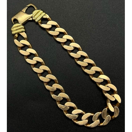 74 - A Heavy 9K Yellow Gold Flat Curb Link Gents Bracelet. 24cm.
54.05g.