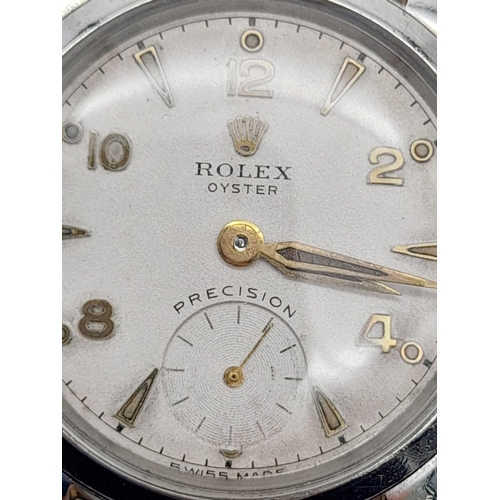 17 - A Vintage Rolex Oyster Precision Watch. Leather strap. Stainless steel case - 30mm. White dial with ... 