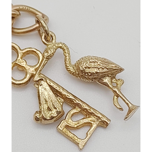 96 - A 9K Yellow Gold Charm Bracelet with Heart Clasp. 10 charms including the Cat and the Fiddle! 18cm. ... 