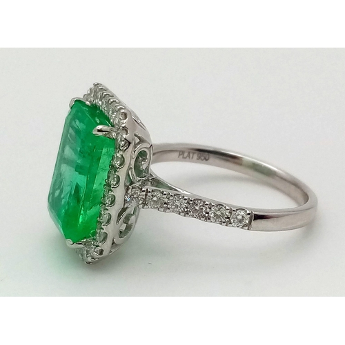 90 - A 950 Platinum 6.19ct Colombian Emerald and Diamond Ring. Octagonal mixed cut emerald with a diamond... 