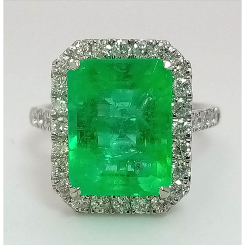 90 - A 950 Platinum 6.19ct Colombian Emerald and Diamond Ring. Octagonal mixed cut emerald with a diamond... 