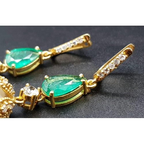 118 - A Pair of High Karat Gold, Large South Sea Pearl, Emerald and Diamond Earring and Pendant Set. 4cm d... 