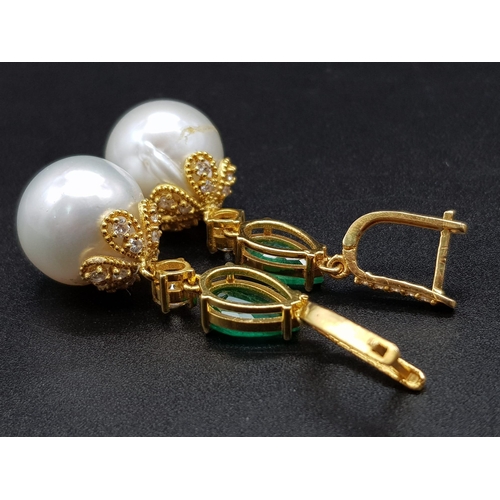 118 - A Pair of High Karat Gold, Large South Sea Pearl, Emerald and Diamond Earring and Pendant Set. 4cm d... 