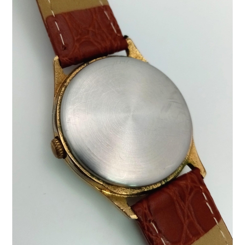 1555 - A Jason Masonic Gents Watch. Brown leather strap. Two tone steel case - 34mm. White dial with Masoni... 