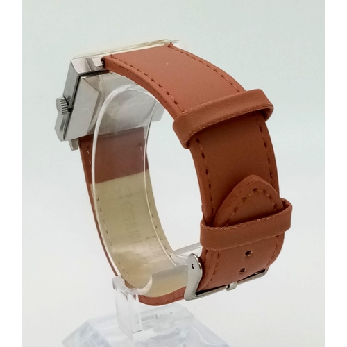 199 - A Vintage Favre-Leuba Daymatic Watch. Brown leather strap. Square case - 30mm. Peach dial with date ... 