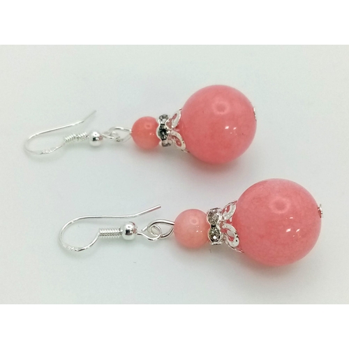 1546 - A Pair of Pink Jade Graduated Ball Drop Earrings. 3cm drop. Largest ball - 14mm.