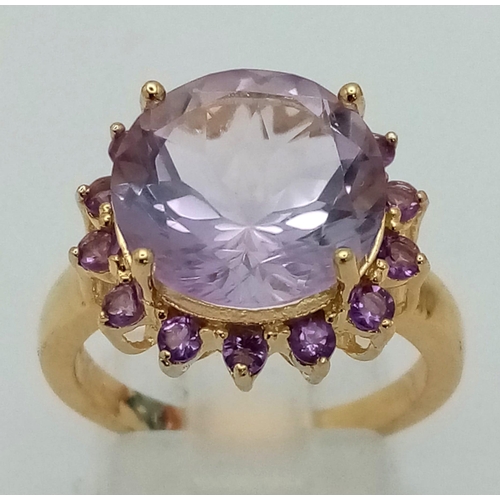 1557 - A Gold Plated 925 Silver Amethyst Ring. Central amethyst surrounded by a halo of smaller amethysts. ... 