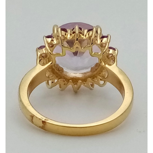 1557 - A Gold Plated 925 Silver Amethyst Ring. Central amethyst surrounded by a halo of smaller amethysts. ... 