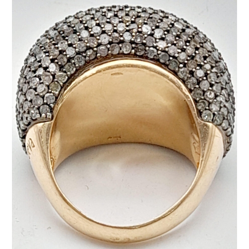 143 - A Large 18K Rose Gold Diamond Cluster Ring. Over 3ct of diamonds in a pave setting. Size V. 20.56g t... 