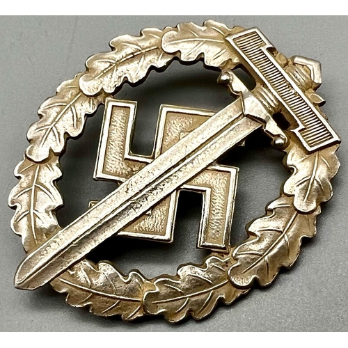 568 - WW2 German SA Disabled Veterans Sports Badge. A silver grade example depicting a Roman broadsword, s... 