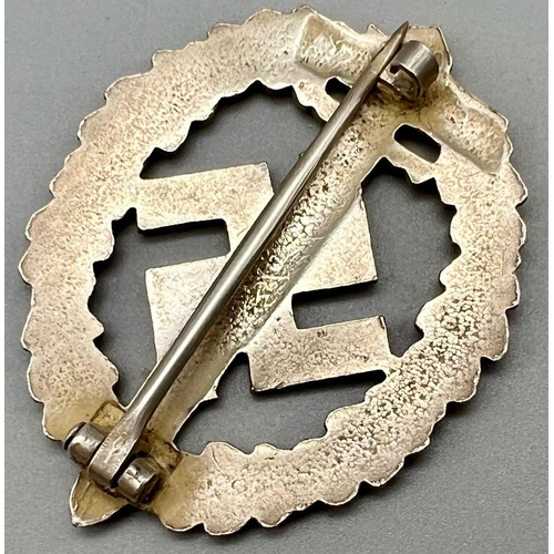 568 - WW2 German SA Disabled Veterans Sports Badge. A silver grade example depicting a Roman broadsword, s... 