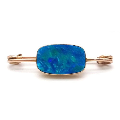 98 - An Antique 9K Rose Gold and Possibly Opal Bar Brooch. Rectangular shimmering blue opal. 4cm brooch l... 