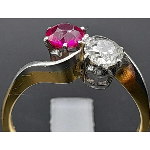 153 - A Glorious 18K Yellow Gold Ruby and Diamond Crossover Ring. A beautiful clean round cut (0.6ct each)... 