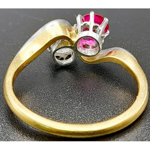 153 - A Glorious 18K Yellow Gold Ruby and Diamond Crossover Ring. A beautiful clean round cut (0.6ct each)... 