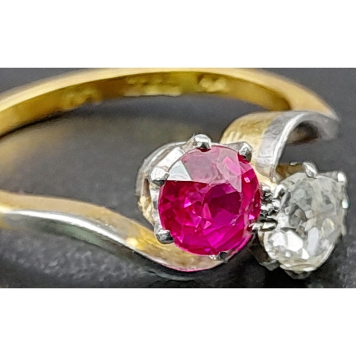 153 - A Glorious 18K Yellow Gold Ruby and Diamond Crossover Ring. A beautiful clean round cut (0.6ct each)... 