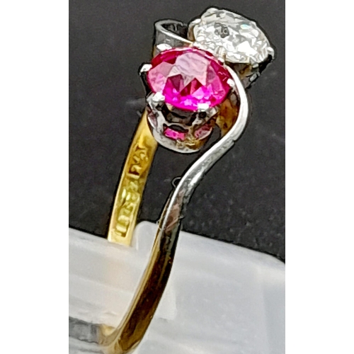 153 - A Glorious 18K Yellow Gold Ruby and Diamond Crossover Ring. A beautiful clean round cut (0.6ct each)... 