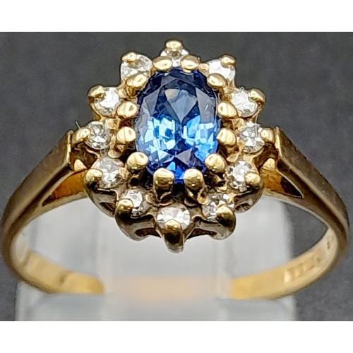 207 - A Vintage 9K Yellow Gold Ceylon Sapphire and Diamond Ring. The oval Ceylon sapphire punches well abo... 