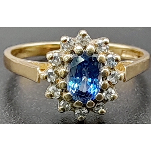 207 - A Vintage 9K Yellow Gold Ceylon Sapphire and Diamond Ring. The oval Ceylon sapphire punches well abo... 