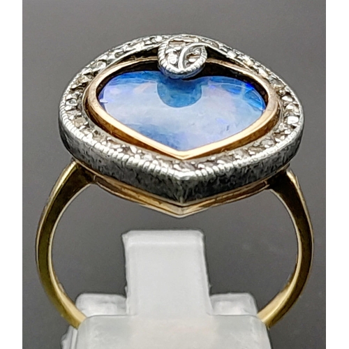 221 - An Antique 18K Gold Georgian Black Harlequin Opal Ring. Heart-shaped with a diamond serpentine surro... 