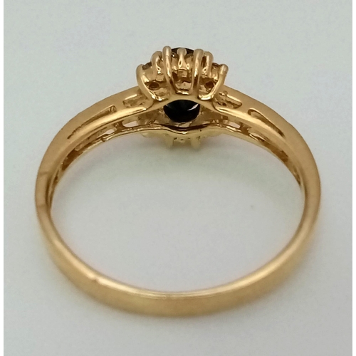 135 - A 9 K yellow gold, diamond ((0.20 carats) and sapphire (0.50 carats) ring. Size: M, weight: 2.1 g.