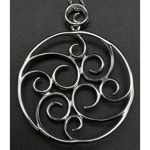 79 - An 18 K white gold, swirl pendant with diamonds (1.75 carats0. Weight: 14. 6 g.