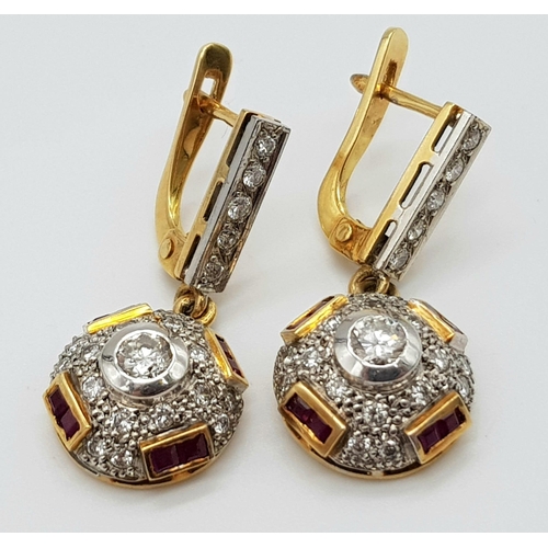 219 - A vintage, 18 K yellow gold pair of earrings with diamonds ( 1 carat appr.) and rubies. weight: 8.6 ... 