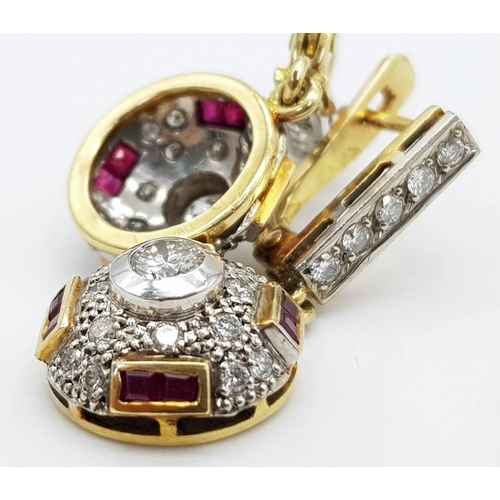 219 - A vintage, 18 K yellow gold pair of earrings with diamonds ( 1 carat appr.) and rubies. weight: 8.6 ... 