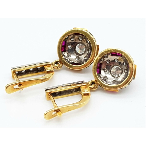 219 - A vintage, 18 K yellow gold pair of earrings with diamonds ( 1 carat appr.) and rubies. weight: 8.6 ... 