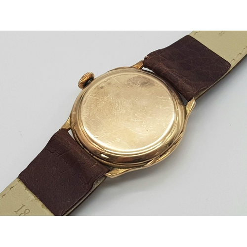 48 - VINTAGE 9CT ROSE GOLD CASED MANUAL WIND WRISTWATCH ON BROWN LEATHER STRAP