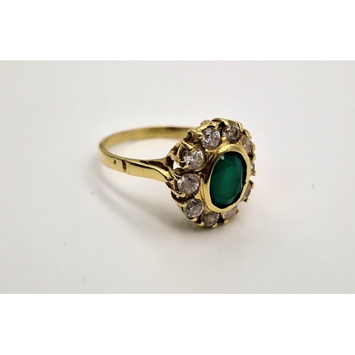 58 - An 18 K yellow gold, stone set cluster ring. Size: Q, weight: 5.6 g.